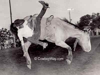 Bronc bucking off bronc rider