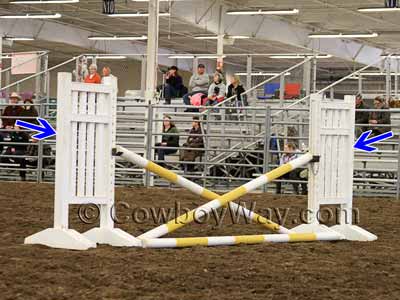 Jump standards with a cross rail schooling jump